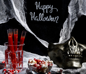 Festive Halloween cocktails and halloween decor for party.