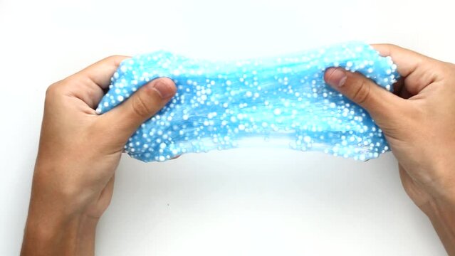 The slime is blue with white foam balls. ASMR relaxation video,