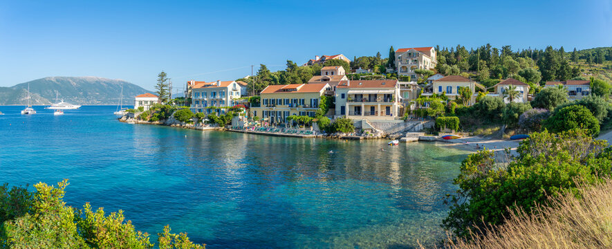 View of hotels overlooking Fiscardo harbour, Fiscardo, Kefalonia, Ionian Islands, Greek Islands