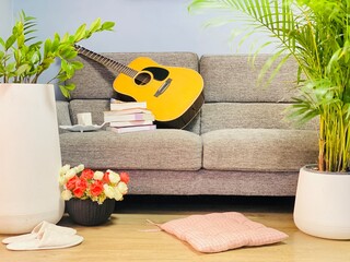 Guitar playing corner for the entertainment of people in a modern style home.