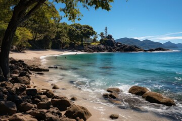 A panoramic vista of a secluded sandy beach, surrounded by lush tropical vegetation and framed by the calm, azure waters of the sea