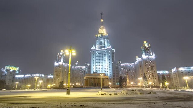 The Main Building of Moscow State University front view on Sparrow Hills at Enchanting Winter Night Timelapse Hyperlapse. This iconic university is illuminated, creating a captivating nighttime scene
