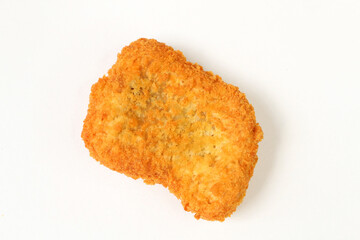 Chicken nuget is served on a plate with a white background