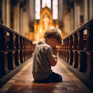 Child praying in a church.