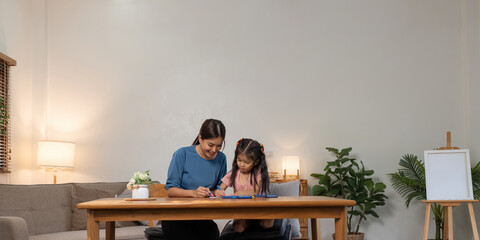 Mother and her daughter draw in the paper together, Leisure activities, holiday