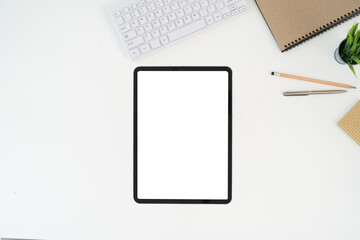 Modern desk workspace with blank copy space mockup with blank screen tablet, coffee cup, technology, headphones with equipment other office top view freelance business concept for social media