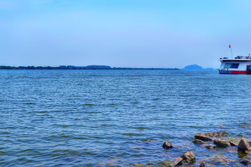 Azure Majesty_A Serene River Flowing Under China's Sunlit Sky