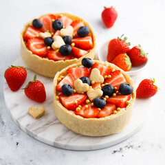 Homemade tarts with strawberry and blueberry