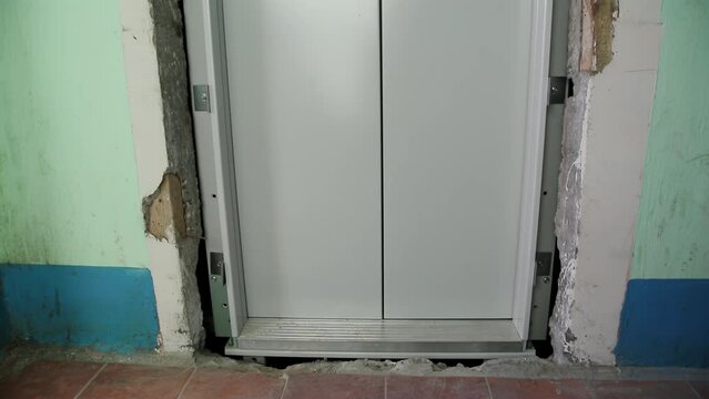 The doors of the new elevator on the staircase. Replacing an old elevator with a new one at the end of its service life, industry