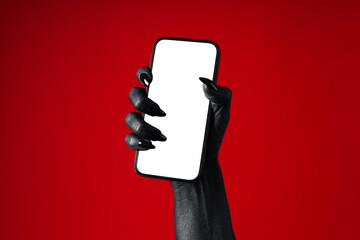 A black hand holds a phone, on a red background. © Atlas