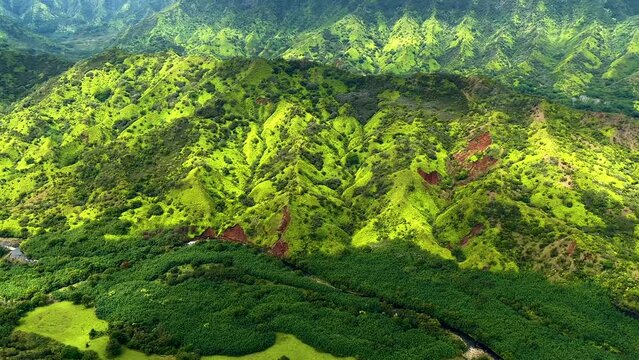Aerial Kauai Pacific lush green volcanic mountain valley 