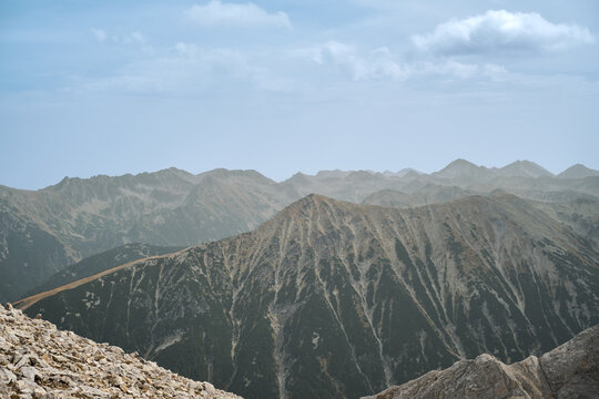 View from Kutelo peak to the Pirin mountain range, national park in Bulgaria, haze over the mountains