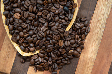 coffee beans in heart-shaped tra,y representing love of coffee