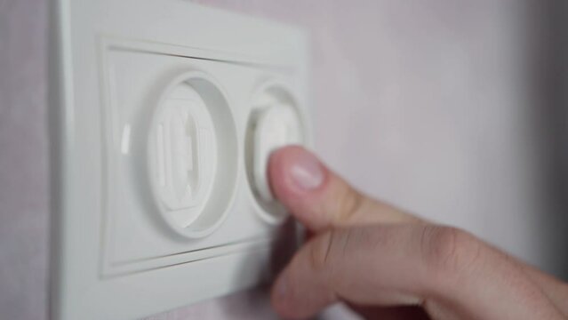 Electrical plug in the socket to protect children from electric shock, close-up