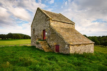Foto op Canvas West Side of Swinburne Tithe Barn, located at Great Swinburne in Northumberland the Tithe Barn is Grade II Listed and used in the Middle Ages to store farmers contribution to sustain local clergy © drhfoto