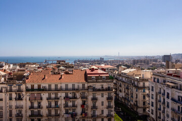 Cityscape of Algiers, Alger, Algeria, with white residential buildings in the foreground.