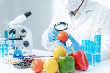 Scientist check chemical food residues in laboratory. Control experts inspect quality of fruits,...