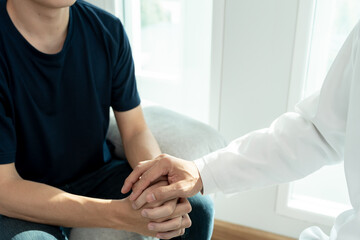 Fototapeta premium psychiatrist hold hand support each while discussing family issues. doctor encourages and empathy woman suffers depression. psychological, save divorce, Hand in hand together, trust, care