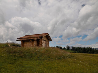wooden hut in monte croce cross mountain in dolomites badia valley panorama landscape