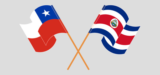 Crossed and waving flags of Chile and Costa Rica