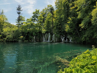 Summer view of water lakes and beautiful waterfalls in Plitvice Lakes National Park, Croatia