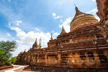Fototapeta premium The Paya Dhammayazika in the surroundings of New Bagan, with its bell-shaped gilded dome, Myanmar, Asia
