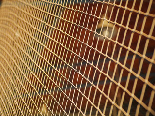 Futsal field boundary net photographed up close with sunlight in the afternoon