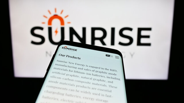 Stuttgart, Germany - 09-20-2023: Mobile phone with website of Chinese company Sunrise New Energy Co. Ltd. on screen in front of business logo. Focus on top-left of phone display.