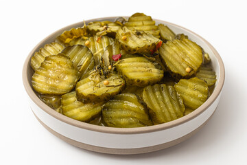 Dill pickles on a white background
