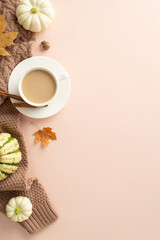 Autumn's coziness at a glance. Vertical top view photo highlighting brown knitted sweater, steaming...