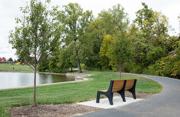 Park Bench Facing Pond with Curving Path