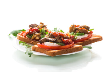 Prepared sandwich with tomatoes, mozzarella and fried eggplant with mushrooms.