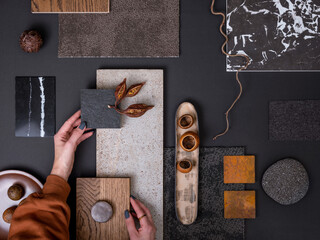 Elegant  flat lay composition in grey and black color palette with textile and paint samples,...