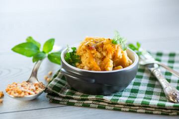 Cooked pea porridge with spices and seasonings in a ceramic bowl .