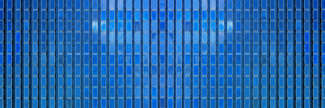 Aerial top view Row of solar cells floating on the water in solar power station or floating photovoltaics (FPV), Solar Photovoltaic of solar farm, water storage. floating solar, renewable energy.