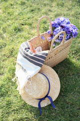 picnic basket with flowers and hat