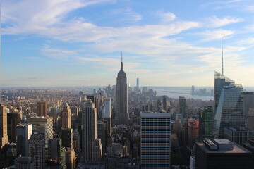 Panorama of New York City, view from the Rockefeller Center observation deck. On the Sunset. Empire State Building view