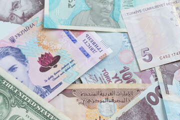 close up of several countries banknotes