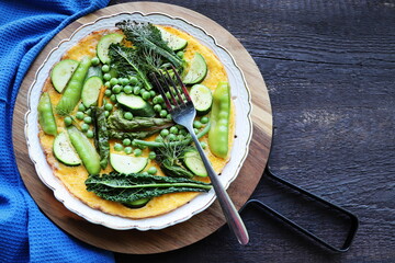Delicious eggs omelette with green vegetable