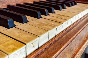 real elephant ivory piano keys on old wooden grand piano black and white keys with dirt, sweat and...