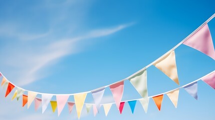 Colorful party pennants chain, garland with flags, on background of a blue sky
