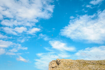 Seagull over Sa Falconera in Menorca Island, Spain. - 653294617