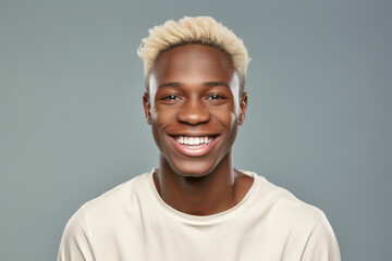 A picture of a man with blonde hair smiling directly at the camera. This image can be used to portray happiness, confidence, and approachability.