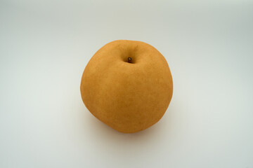 A side view of a juicy pear, white background