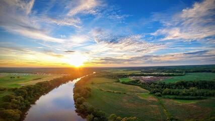 Naklejka premium sunset over a river