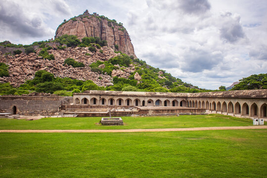 View of Rajagiri hill and the excavated palace site in the Gingee Fort complex in Villupuram district, Tamil Nadu, India. Focus set on hill rocks.