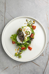 delicious breakfast fried eggs with greens 