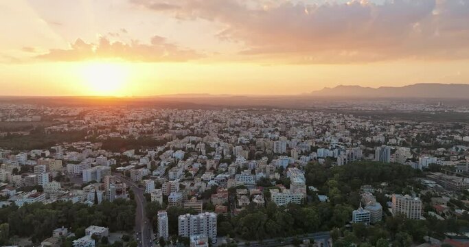 Metropolitan Marvel: Aerial View Showcasing Nicosia, the Capital of Cyprus, at Dusk. High quality 4k footage
