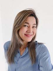 Happy pretty Thai asian office women take selfie, smiling and looking at camera feeling good, isolated on white background.