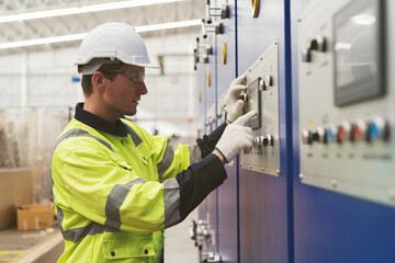 Male electrician engineer maintenance electric system in industry factory. Factory male worker at...